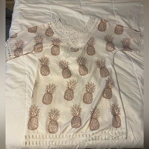 swim cover up. it has pineapple and barely worn. lace trim.